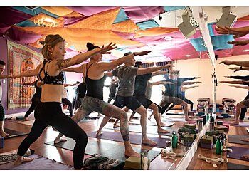 Photo of CAMBIO YOGA, Vinyasa Flow, Power Vinyasa, Vinyasa For In-Betweeners, Vinyasa For Beginners, Vinyasa Yin Combo, Heated Vinyasa Flow, Hot Power Fusion, 60 Min Hot, Gentle, Yin Yoga, Restorative, Curvy, Yoga Fusion for Mobility &amp; Kids Yoga in COLORADO SPRINGS