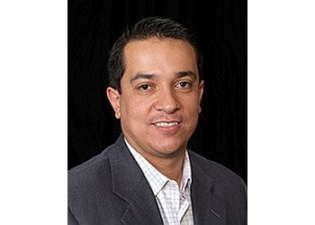 Photo of CARLOS BRETON, TREATMENTS OFFERED:  Dental Exams and Teeth Cleanings, Dental Crowns, Bridges, Complete and Partial Dentures, Implants, Cosmetic Dentistry, Root Canal, Veneers, Invisalign, Teeth Whitening &amp; Fillings in TAMPA