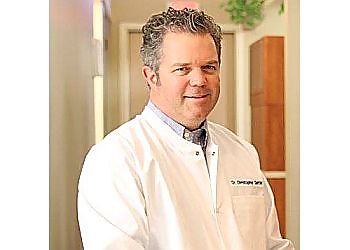 Photo of CHRISTOPHER SANTAY, CONDITIONS TREATED: Gum Disease, Oral Cancer &amp; Sleep Apnea TREATMENTS OFFERED: Family and Preventative Dentistry, Tooth-colored Fillings, Implants, Root Canal Therapy, Tooth Whitening, Porcelain Crowns, Bridges, Metal-Free White Fillings, Smile Makeovers, Veneers &amp; Invisalign in SYRACUSE