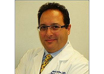 Photo of DAVID A. STOLLER, CONDITIONS TREATED: Fungal Toenails, Athlete&#x27;s Feet, Ingrown Toenails, Warts, Heel Pain, Bunions, Hammertoes, Diabetic Foot Care, Foot Pain and Ankle Sprain TREATMENTS OFFERED: Wound Care, Infection, Custom Orthotics, Sports Medicine, Joint Manipulation, Direct Digital Radiography, European Foot Care Treatment, Manual Manipulation of Subluxated/Dislocated Joints &amp; Vascular Testing in TULSA