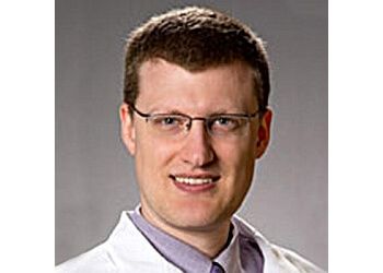 Photo of DAVID CLARK, CONDITIONS TREATED:Epilepsy and Seizure Disorders Epilepsy, Huntington&#x27;s Disease, Migraine and Headaches, Movement Disorders, Parkinson&#x27;s Disease, Multiple Sclerosis, Peripheral Neuropathy, TIA and Stroke, Tremors, Brain and Spinal Cord Infection, Brain Injuries, Brain Tumors, Dizziness and Vertigo &amp; Alzheimer’s Disease

TREATMENTS OFFERED:Computerized Tomography (CT) Scan, Electroencephalogram (EEG), Electromyogram (EMG), Evoked Potentials to Measure Your Brain&#x27;s Response to Stimulation, Magnetic Resonance Angiogram (MRA), Magnetic Resonance Imaging (MRI), Muscle or Nerve Biopsy, Nerve Conduction Study (cs), Non-Invasive (Blood and Urine) Tests &amp; Spinal Tap in OVERLAND PARK
