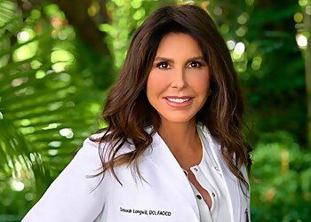 Photo of DEBORAH LONGWILL, CONDITIONS TREATED:Acne, Hyperhidrosis (Sweaty Hands), Psoriasis Treatment, Malignant Melanoma, Tinea Athlete’s Foot, Wart Removal, Pediatric Dermatology, Rosacea and Perioral Dermatitis, Seborrheic Dermatitis, Atopic Dermatitis (Eczema), Pityriasis Rosea, Tinea Versicolor, Vitiligo, Melasma, Alopecia (Hair-Loss), Urticaria, Lupus and Collagen Vascular Disease, Skin Infection, Sexually Transmitted Infections, Skin Neoplasms, Onychomycosis, Mohs Surgery &amp; Skin CancerTREATMENTS OFFERED:Cool Sculpting®, Cool Tone®, Botox®, Kybella®, Sclerotherapy, Dysport®, Micro Needling, Hydra Facial™, Ultherapy®, Fraxel®, Tattoo Removal, Broad Band Light™ Therapy &amp; Accent Body Laser in MIAMI