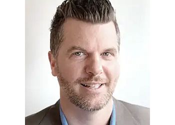 Photo of DR. BRANDON HOWELL, CONDITIONS TREATED:Acne and Scarring, Anti-Aging and Prevention, Cellulite/Stubborn Fat, Dark Eye Circles, Excessive Sweating (Hyperhidrosis), Hooded Eyes and Under Eye Bags, Jowls/Double Chin, Lips, Loose Skin, Neck, Chest and Hand Rejuvenation, Pigmentation/Melasma, Rosacea/Redness, Stretch Marks, Sun Damage, Unwanted Hair, Wrinkles, Vaginal &amp; Urinary IssuesTREATMENTS OFFERED:AlumierMD™, Botox™/Xeomin™/Dysport™, Chemical Skin Peels, Dermal Fillers, Evoke® Facial Contouring, EvolveX® Body Contouring, Forma®/Plus®, Laser Hair Removal, Lumecca™ IPL, Men’s Health, Plus90® or Votiva® (Vaginal Wellness), Radiesse™, RF Microneedling (Morpheus8™/Fractora™), Skin Care Consultations, Skinboosters™ &amp; SkinCeuticals™ in GUELPH