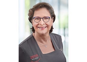 Photo of DR. CHRISTINE MARCOUX, TREATMENTS OFFERED:Oral Health Examination and Diagnostics, Hygiene, Cleaning, Filling, Whitening and Cosmetic Dentistry, Treatment of A Canal, Gum Health, Gum Surgery, Dental Implant Crowns &amp; Bridges in LONGUEUIL