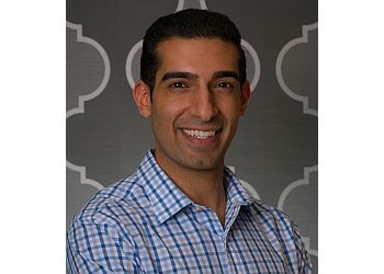 Photo of DR. FARHAN SHIVJI, TREATMENTS OFFERED: Biopsies and Sedation Dentistry, Composite Tooth-Coloured Fillings, Cosmetic Veneers, Porcelain Inlays, Onlays, and Crowns, Polishing, Invisalign®, Root Planing, Teeth Whitening, Extractions, Dental Implants, Bone Grafts &amp; Sinus Lifts in NEW WESTMINSTER