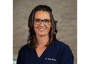 Photo of DR. HOLLY DUNLOP, TREATMENTS OFFERED:Invisalign, Braces, Dental Crowns, Teeth Whitening, Dental Bonding, Dental Implants, Dentures, Dental Veneers, Dental Cleaning, Oral Cancer Screening, Mouthguards, Fluoride Treatment, Dental Sealants, Invisalign, Space Maintainers, Oral Surgery, Tooth Extractions &amp; Wisdom Tooth Extractions in SASKATOON