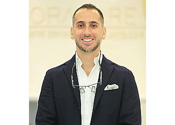 Photo of DR. JOSEPH COUSSA, TREATMENTS OFFERED:  General Dentistry, Periodontal Treatment, Oral Cancer Screenings, Tooth Extractions and Dental Sedation, Tooth Fillings, Root Canals, Gum Grafts, Dentures, Cosmetic Dentistry, Teeth Whitening, Crowns, Veneers, and Bridges, Clear Braces (Invisalign), Sealants, Fluoride Applications &amp; Sports Mouth Guards in MONTREAL