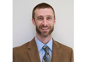 Photo of DR. JUSTIN BROWN, CONDITIONS TREATED: Heel Pain, Bunions, Hammertoes, Ankle Sprains, Ankle Fractures, Sports Injuries, Flat Feet, Diabetic Feet, Ingrown Nails, Corns, Achilles Tendonitis, Corns and Callouses, Warts, Geriatrics and Fungal Nails TREATMENTS: Custom Orthotics, Laser Toenail Treatment &amp; Non-Invasive Vascular Testing in MIDLAND