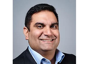 Photo of DR. KUNAL BHANOT, TREATMENTS OFFERED:Microdiscectomy for Lumbar (Lower Back) Herniated Disc, Posterior Cervical (Neck) Decompression and Fusion &amp; Anterior Cervical (Neck) Decompression in KITCHENER