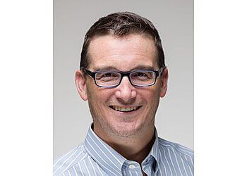 Photo of DR. MICHAEL BRIDGE, CONDITIONS TREATED:Foot and Ankle Disorders, Bunions, Deformities, Toe Deformities, Rheumatoid Joint Disease, Osteoarthritis and Post-traumatic, Achilles Tendon Pathology, Lower Extremity Tendon Disorders, Plantar Fasciitis and Fibromatosis, Ankle Instability, Foot and Ankle Sports InjuriesTREATMENTS OFFERED: Orthopaedic Trauma &amp; Ankle Arthroscopy in KELOWNA