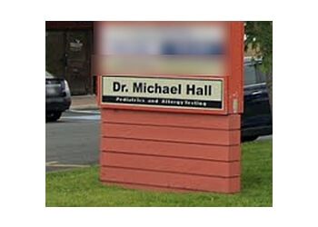 Photo of DR. MICHAEL HALL, CONDITIONS TREATED:Fever, Ear and Throat Infections, Allergies, Rashes, Asthma, Flu, Bronchitis and Eye Infections
TREATMENTS OFFERED:Annual Check-ups, Immunization, Primary Care, Minor Injuries, Emergency Sick Visit, Well Baby Visits &amp; Vaccination in ST. JOHN&#x27;S