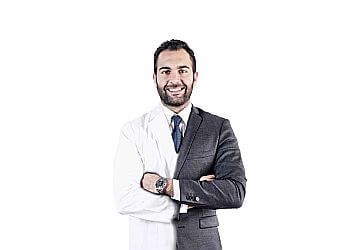 Photo of DR. MOHAMAD MAWLAWI, TREATMENTS OFFERED: Dental Exams and Fillings, Dentures, Crowns and Bridges, Maxillofacial Surgery and Periodontics, Root Canal, Mouth Guards, Digital X-Rays, Oral Cancer Screening, Pediatric Dentistry &amp; Implants in MONTREAL
