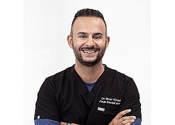 Photo of DR. OMAR VIRANI, CONDITIONS TREATED: Cracked Tooth, Tooth Wear, Bad Breath, Gingivitis, Bleeding Gums and Oral Cancer
TREATMENTS OFFERED: Root Canal, Dental Crowns, Dental Fillings, Teeth Whitening, Braces, Clear Aligners, Gum Recession, Dental Bonding, Porcelain Veneers, Invisalign, Dental Sealants &amp; Oral Hygiene Instructions in NORTH VANCOUVER