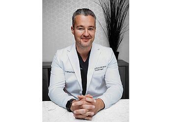 Photo of DR. PAUL KUZEL, CONDITIONS TREATED: Acne, Eczema, Excessive Sweating, Hyperpigmentation, Migraines, Moles, Psoriasis, Rosacea, Scarring, Skin Cancer &amp; WartsTREATMENTS OFFERED:Cosmetic Botox®, Dermal Filler, Exosomes, Platelet-Rich Plasma, Radiesse, Sculptra, UV Therapy, Photodynamic Therapy, Glycolic Peel, Jessner Peel, Vivier Peel, Bela MD+, HydraFacial®, O Cosmedics Facial, Red Carpet Facial, Signature Facial, Clear + Brilliant®, CO2 Resurfacing, EndyMed Resurfacing, Fotona, Laser Hair Removal, RF Microneedling, Vbeam Laser, Sofwave™, CoolSculpting®, CoolTone®, Dermaplaning, RF Microneedling, Tattoo Removal, Vaginal Rejuvenation &amp; Sclerotherapy in CALGARY