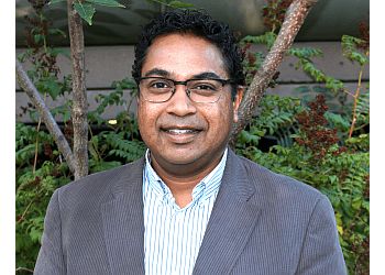 Photo of DR. RICHARD PERSADIE, TREATMENTS OFFERED:  Ultrasound in Obstetrics and Gynecology, Laparoscopically Assisted Vaginal Hysterectomies, Laparoscopic Management of Ovarian Cysts &amp; Ectopic Pregnancies in HAMILTON