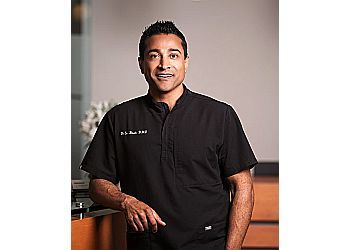 Photo of DR. SAN BHATHA, CONDITIONS TREATED:
TMJ Disorders, Sensitive Teeth, Dental Trauma and Tooth Pain
TREATMENTS OFFERED:
Soft Tissue Surgical Procedures, Sinus Lift, Athletic Mouthguards, Desensitizing Treatment for Sensitive Teeth, All-on-4 Dental Implants, Cosmetic Dentistry, Full Mouth Reconstruction, Hygiene Services, Invisalign Treatment, Root Canal Therapy, Smile Makeovers, Perio Protect, Tooth-Colored Fillings, Dental Implants, Gingival Recontouring, Veneers, Bonding, Restorative Dentistry, Crowns, Bridges, Teeth Whitening, Emergency Dentistry &amp; Sedation Dentistry in SURREY