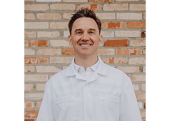 Photo of DR. TONY ROMANIUK, TREATMENTS OFFERED:Crowns, Bridges, Dentures, Sedation, Invisalign, Teeth Whitening, Lumineers, Veneers, General and Family Dentistry, Cosmetic, Restorative, Pediatric, Dental Hygiene, Implants, Orthodontics, Root Canals &amp; Whitening in REGINA