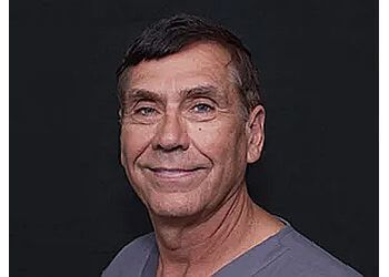 Photo of DR. WILLIAM B. JANUSHEWSKI, CONDITIONS TREATED: TMJ and Senior Dental Care TREATMENTS OFFERED: Kid&#x27;s Dentistry, General Dentistry, Dental Bridges, Crowns, Implants, Dentures, Emergency Dentistry, Family Dental Care, Night Guard, Root Canal, Teeth Cleaning, Wisdom Teeth Removal, Cosmetic Dentistry, Invisalign, Teeth Whitening &amp; Veneers in NORFOLK