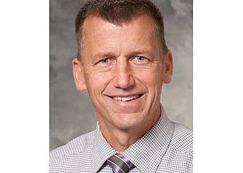 Photo of GREGORY K. HARTIG, CONDITIONS TREATED: Balance Disorders and Dizziness, Facial Nerve Disorders, Facial Trauma, Head and Neck Cancer, Obstructive Sleep Apnea, Disorders of The Sinuses, Swallowing Difficulties, Voice Disorders, Benign Paroxysmal Positional Vertigo, Dizziness and Balance Disorders, Hearing Loss, Chronic Ear Infections, Acid Reflux, Allergies, Sinuses and Nasal Cavity, Airway Disorders, Hypernasality &amp; Hyponasality TREATMENTS OFFERED: Comprehensive Head and Neck Surgery, Ear Canal and Ear Drum Repair, Facial Feminization Surgery, Mandibular Advancement Devices Therapy, Nasal Reconstructive Surgery, Sialendoscopy, Skull-Base Surgery, Surgery for Acoustic Neuroma and Cholesteatoma &amp; Surgery to Treat Facial Paralysis in MADISON