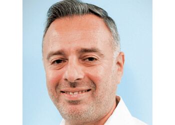 Photo of GREGORY TRAKHTENBERG, CONDITIONS TREATED: Trauma, Surgery, Postural Strain, Repetitive Motion, Muscles, Ligaments and Tendons, Dysfunction, Tight Muscles and Stiff Joints &amp; Fascial Counterstrain
TREATMENTS OFFERED:Soft Tissue Mobilization, Myofascial Release, Trigger Point Release, Medical Massage, Deep Tissue Mobilization, Osteopathic Manipulative Medicine, Post-Operative Rehabilitation, Kinesio Taping, Spinal Manipulation, Spine Treatment Program, Posture &amp; Balance Training in NEW YORK CITY