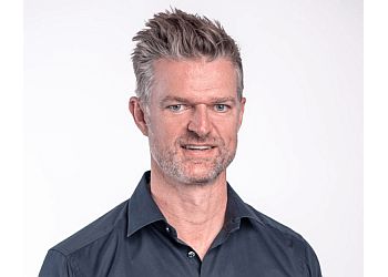 Photo of IAN GOODWIN, CONDITIONS TREATED:
Osteoporosis, Fractured or Weakened Bone, Neurological Deficits, Bleeding Disorders, Excessive Joint Mobility, Joints, Tendons &amp; Nerves 
Joint Manipulation and Mobilization, Intramuscular Stimulation (IMS), Shockwave Therapy, Class IV Laser Therapy, Medical Acupuncture, Muscle Activation Techniques (MAT)™, Pelvic Health Physiotherapy, Massage and Soft Tissue Therapy, Sport-Specific and Post-Operative Rehabilitation, Exercise Prescription, Running Gait Assessment, X-Ray, Ultrasound, MRI Referral &amp; Virtual Physiotherapy Consultation in CALGARY