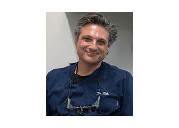 Photo of ILYA ZAK, CONDITIONS TREATED: Periodontal Disease and Oral Cancer Screening TREATMENTS OFFERED: Exam and Cleanings, Cosmetic Dentistry, Crowns, Teeth Whitening, Veneers, Replacing Missing Teeth, Night Guard, Root Canal Therapy, Orthodontics, Sedation, Zirconia Crowns, Full Mouth Reconstruction &amp; Oral Hygiene in SIMI VALLEY