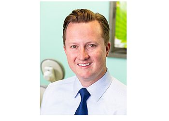 Photo of JACOB ROGERS, CONDITIONS TREATED: Sleep Apnea and Gum Disease TREATMENTS OFFERED: Teeth Whitening, Professional Teeth Cleanings, Invisalign, Implants, Dentures, Porcelain Veneers, Same-Day Crown, Pediatric Dental Care, Six Month Braces, Oral Surgery, Digital X-Rays, Tooth Extraction, Root Canal &amp; Bridges in ALBUQUERQUE