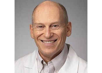 Photo of JEFFREY KAPLAN, CONDITIONS TREATED:Acute Spinal Problems, Pinched Nerves in the Neck and Low Back, Spinal Pain, and Reduced Range of Motion, Multiple Sclerosis, Dementia/Memory Problems, Epilepsy, Headache/Migraine, Neuropathy, Pinched Nerve and Muscle Disorders, Tingling, Numbness, Weakness and Wasting, Muscle Twitching, Parkinson’s Disease &amp; Tremors

TREATMENTS OFFERED:Cosmetic Injections, Deep Brain Stimulation, EEG, Electromyography (EMG), Nerve Conduction Studies, Evoked Potential (EP) Central Motor, Spinal Tap &amp; Nerve Conduction Velocity (NVR) in OVERLAND PARK