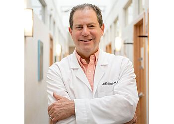 Photo of JOEL SCHLESSINGER, CONDITIONS TREATED:Acne, Psoriasis, Skin Cancer, Mole Removal, Poison Ivy, Rash, Rosacea, Scar Treatment, Seborrheic Dermatitis, Skin Tags, Sunburn, Tinea Veriscolor, Toenail Fungus &amp; WartsTREATMENTS OFFERED:Wrinkle Relaxers, Dermal Fillers, Total Facial Rejuvenation, Skin Tightening Treatment, Microneedling, Ipl Treatment, Fraxel Laser Treatment, Laser Hair Removal, Laser Tattoo Removal, Leg Veins, Visia Skin Analysis, Non-Invasive Fat Reduction, Cellulite Treatment, Chin Fat Reduction, Liposuction, Latisse &amp; Upneeq® in OMAHA