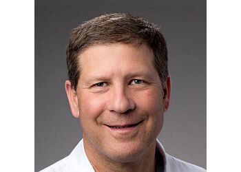 Photo of JOHN A. CLOUGH, CONDITIONS TREATED: Brain Tumors, Dizziness and Vertigo, Epilepsy and Seizure Disorders Epilepsy, Huntington&#x27;s Disease, Migraine and Headaches, Multiple Sclerosis, TIA and Stroke, Tremors, Peripheral Neuropathy, Movement Disorders, Parkinson&#x27;s Disease, Brain and Spinal Cord Infection &amp; Brain Injuries 
TREATMENTS OFFERED:Minimally Invasive and Endoscopic Neurosurgery, Brain Tumour Surgery, Laminectomy &amp; Craniotomy in OVERLAND PARK