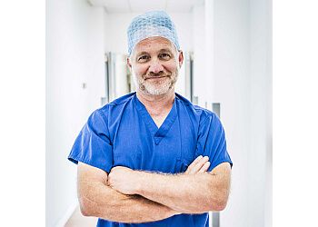 Photo of JOHN A. DAVISON, Breast Uplift Mastopexy, Nipple Eversion, Arm Lift (Brachioplasty), Breast Reduction, Rhinoplasty, Ear Correction, Face and Neck Lift Surgery, Brow Lift, Augmentation (Implants) and Uplift, Labiaplasty, Blepharoplasty, Expanded Earlobe Correction, Liposuction, Thigh Lift, Male Breast Reduction, Cysts, Warts, Moles &amp; Skin Tag Removal, Abdominoplasty, Botox, Fillers, Dermaroller &amp; Skin Cancer Treatment in CANTERBURY