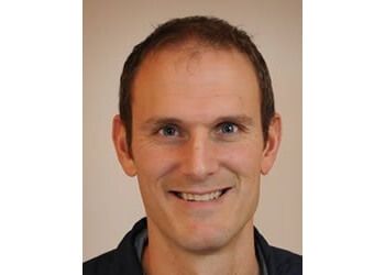 Photo of KEVIN BOS B.SC.PT, CONDITIONS TREATED:Frozen Shoulder, Achilles Tendinopathy, Jumper&#x27;s Knee, Tendonitis and Tendinopathies, Shockwave, Nerve Pain, Bursitis, Hamstring Injuries, Electrotherapy Treatments, Myofascial Trigger Points in Neck/Lower Back, Patellar Tendonitis, Plantar Fasciitis &amp; Calcific Rotator
TREATMENTS OFFERED:Manual and Manipulative Therapy, Intramuscular Stimulation IMS, Acupuncture, Vestibular Rehabilitation, Exercise Therapy, Sports Therapy, Women&#x27;s Health and Pelvic Health, Electrotherapy, Laser Therapy, Pediatric-Kids Physiotherapy, ICBC and Worksafe BC &amp; Shockwave Therapy in KELOWNA