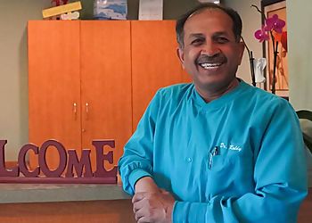 Photo of KRUPAKAR R. YETURU, CONDITIONS TREATED: Oral Cancer, Periodontal Disease and Broken Teeth
TREATMENTS OFFERED: Veneers, Fastbraces, Invisalign, Zoom Teeth Whitening, Bonding, Bridges, Crowns, Fillings, Sealants, Dentures, Digital X-Rays, Fluoride Treatment, Implant Restoration, Laser Dentistry, Mouth and Night Guards, Oral Cancer Screening &amp; Perio Protect in ONTARIO