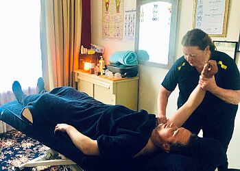 Photo of LOOKING GLASS THERAPEUTIC MASSAGE, Massage therapy specialist