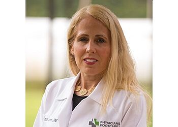 Photo of MAUREEN QUINLAN, CONDITIONS TREATED: Achilles Tendon, Ankle Pain and Sprains, Arthritic Foot Care, Athlete&#x27;s Foot, Bunions, Corns, Diabetic and Geriatric Foot Care, Flat Feet, Foot and Ankle Fractures/Surgery, Foot Pain, Fungal Toenails, Hammertoes, Heel Pain, Heel Spurs, Ingrown Toenails, Morton&#x27;s Neuroma, Plantar Fasciitis &amp; Warts
TREATMENTS OFFERED: Foot Orthotics, Sports Medicine &amp; Wound Care in COLUMBIA