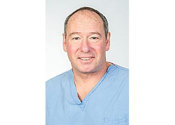 Photo of MICHAEL L. GIORDANO, CONDITIONS TREATED:Foot Pain, Calluses, Corns, Crush and Sports Injuries, Diabetic, Athletes, Geriatric Foot Care, Bunions, Flat Feet, Fungal, Ingrown Toenails, Fractures, Hammertoes, Heel Spurs, Infections, Metatarsalgia &amp; Neuromas in ROCHESTER