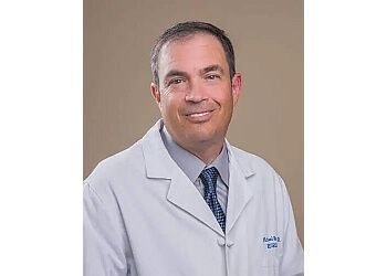 Photo of MICHAEL RAUZZINO, CONDITIONS TREATED:Complex Brain Tumors and Cancers, Aneurysms and Vascular Malformations, Arteriovenous Malformation (AVM), Arachnoid Cysts, Astrocytoma (Common CNS Tumor), Cavernous Malformation, Hemangioblastoma, Deep Brain Stimulation for Parkinson’s Disease and Tremors, Minimally Invasive Spinal Surgery &amp; Traumatic Brain Injury
TREATMENTS OFFERED:Arthroscopy, Knee Ligament Reconstruction, Total Knee Replacement, Total Hip Replacement, Minimally Invasive Knee Replacement, Minimally Invasive Hip Replacement, Lumbar Fusion, Microdiscectomy (Lumbar Decompression), Kyphoplasty/Vertebroplasty, Posterior Cervical Foraminotomy &amp; Hip Resurfacing in COLORADO SPRINGS