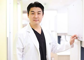 Photo of PAUL TAEHYUNG KIM, CONDITIONS TREATED: Jaw Pain
TREATMENTS OFFERED: Hygiene, Crowns &amp; Bridges, Root Canal Treatment, Wisdom Teeth Extractions, Composite Filling, Removable Dentures, Sedation, Teeth Whitening, Porcelain Veneers / Bonding, Gummy Smile Surgery, Invisalign, Braces, Lingual Braces, Dental Implants, Implant, Implant Dentures &amp; Mini Implants in FULLERTON