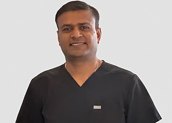 Photo of RAJIV SHEKHADIYA DDS, CONDITIONS TREATED: Cracked Teeth Syndrome, Toothaches, Chipped Tooth, Cracked Tooth, Sensitivity to Hot and Cold, Knocked-Out Tooth, Lost Filling or Crown, Broken Denture, Loose Tooth
TREATMENTS OFFERED: Tooth-Colored Fillings, Dental Crowns, Inlays &amp; Onlays, Root Canal Therapy, TMJ Therapy, Dental Bridges, Dentures, Dental Implants, Tooth Extractions, Bone Grafting, Porcelain Veneers, Invisalign, Metal-Free Dental Restorations, Teeth Whitening, Tooth Recontouring, Spacers, Antibiotic Therapy, Deep Cleaning, Laser Treatment in CARROLLTON