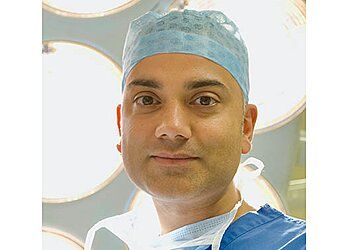 Photo of RICHARD KAROO, Split and Stretched Earlobe Reconstruction, Breast Enlargement, Enlargement with Uplift, Reduction, Asymmetry Correction, Face, Neck, Thigh, Body and Brow Lift, Nose and Ear Reshaping, Eyelid Surgery, Abdominoplasty, Liposuction, Inverted Nipple Correction, Gynaecomastia Surgery, Arm Reduction and Labial Reshaping, Surgical Facial Rejuvenation (Face Lift, Blepharoplasty, Endoscopic Browlift, Rhinoplasty), Non-Surgical Facial Procedures, Cosmetic Breast Surgery–Breast Augmentation (Breast Enlargement), Breast Uplift, Breast Reduction and Body Contouring Procedures, Including Liposuction &amp; Abdominoplasty in CARDIFF