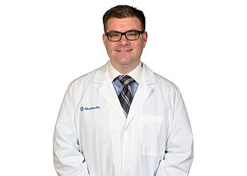 Photo of RONALD JOHN DORBISH, CONDITIONS TREATED: Acute Stroke, Back Pain, Benign and Malignant Brain Tumors, Cervical/Thoracic/Lumbar Disc Herniation, Chiari Malformation, Complex Spine Disorders, Glioblastoma Nerve Entrapment, Normal Pressure Hydrocephalus, Peripheral Neuropathy, Spinal Cord Tumors, Spinal Fusions, Spinal Stenosis, Spine Disease and Disorders, Spine Trauma, Traumatic Brain Injury, Ulnar Nerve Injury and Vertebral Compression Fractures TREATMENTS OFFERED: Carpal Tunnel Surgery, Computer Assisted Surgery/Stealth, Image Guided Spine Surgery, Spine Surgery, Meningioma Surgery, Revision Spine Surgery, Shunt Evaluation &amp; Management in COLUMBUS