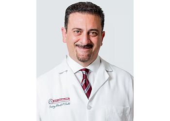 Photo of SAM J. HALABO, TREATMENTS OFFERED:Root Canal Treatments, Complete Check-Ups, Composite Bonding, Veneers, Teeth Whitening, Implants, Fixed Dentures, Bridges, Same Day Crowns, Sealants, Tooth Colored Filling, Invisalign, Pediatric Dentistry, Propel Orthodontics, Extractions, Smile Makeovers, Mouth Guards &amp; Six Month SmilesCONDITIONS:Halitosis, Sleep Apnea, Periodontal Issues, TMJ Disorders &amp; Snoring in CHULA VISTA