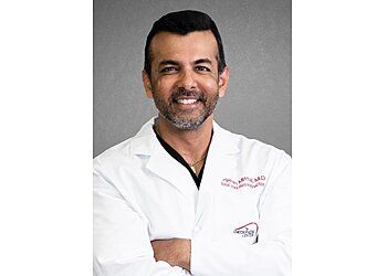 Photo of YOGESH MITTAL, TREATMENTS OFFERED: Total Knee Replacement, Partial Knee Replacement, Total Hip Replacement, ACL Repair/Reconstruction, Total Hip Resurfacing, Knee and Hip Arthroscopy, Arthroscopic Chondroplasty, Makoplasty for Knee and Hip, Joint Replacement, Stem Cell Therapy, Sports Medicine, Fracture Care, Robotic Assisted Surgery of the Hip and Knee, Total Joint Replacement, Regenerative Medicine, Joint Preservation, Total Joint Revisions, Computer-Assisted Surgery &amp; Minimally Invasive Joint Replacement in TULSA